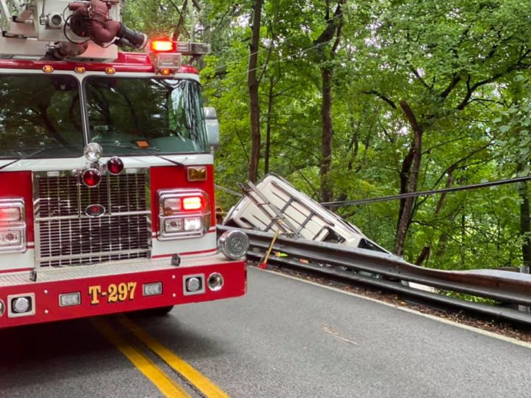 Car over guardrail